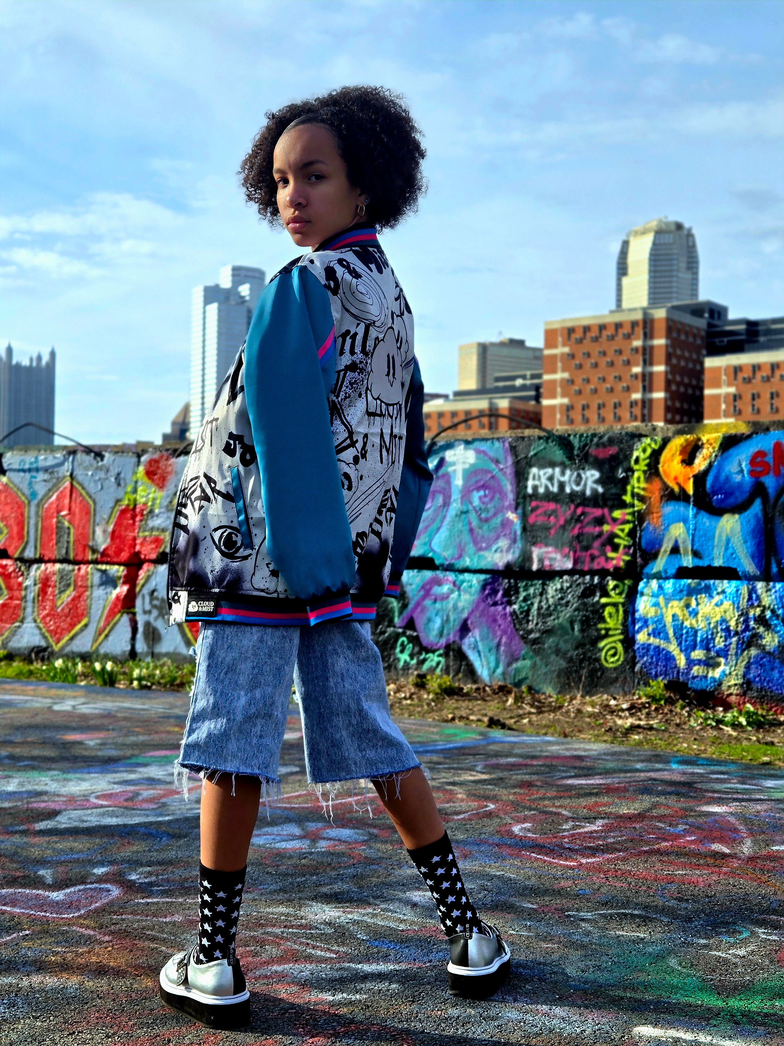 Color graffiti bomber jacket w/teal sleeves