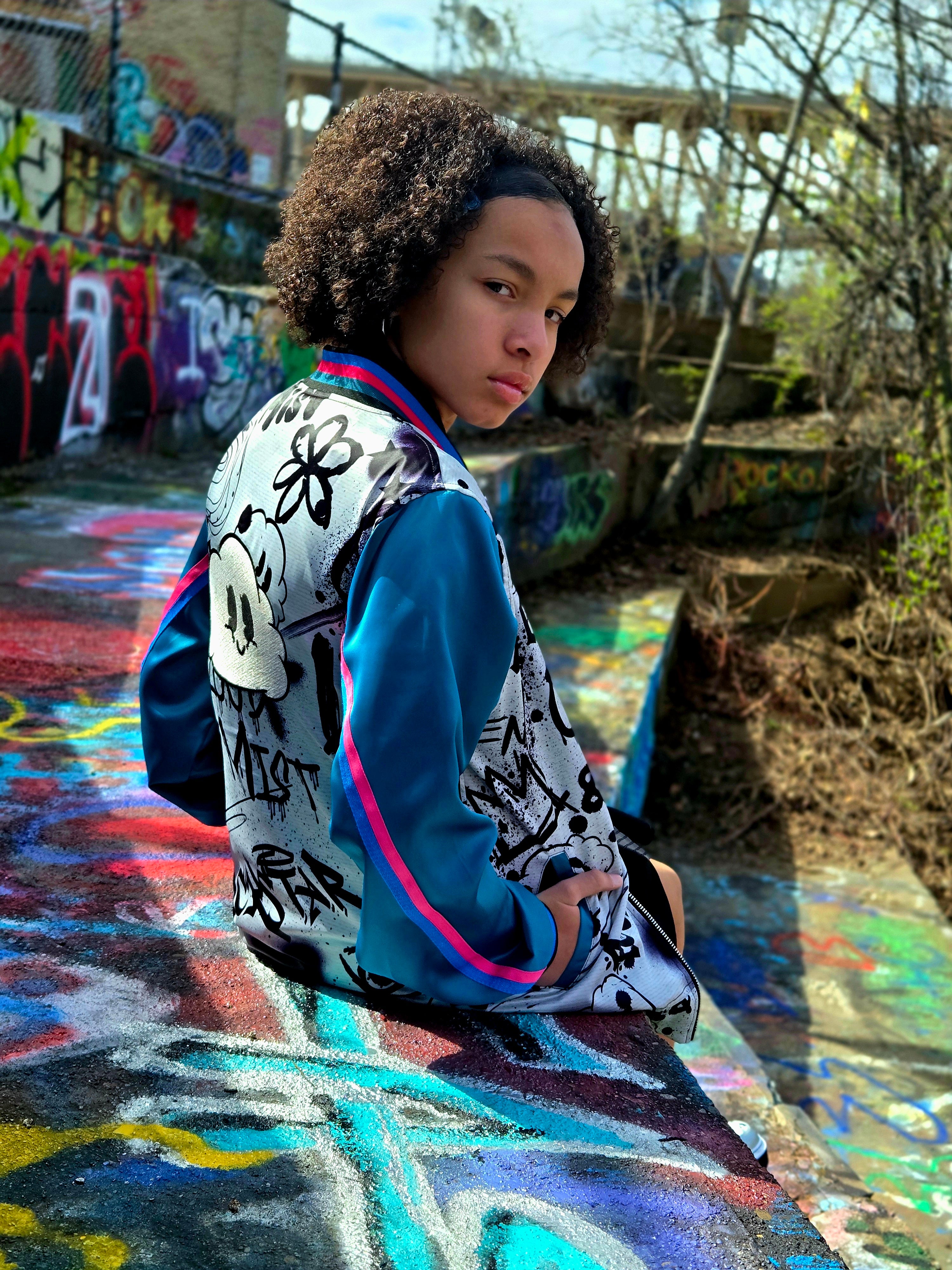 Color graffiti bomber jacket w/teal sleeves